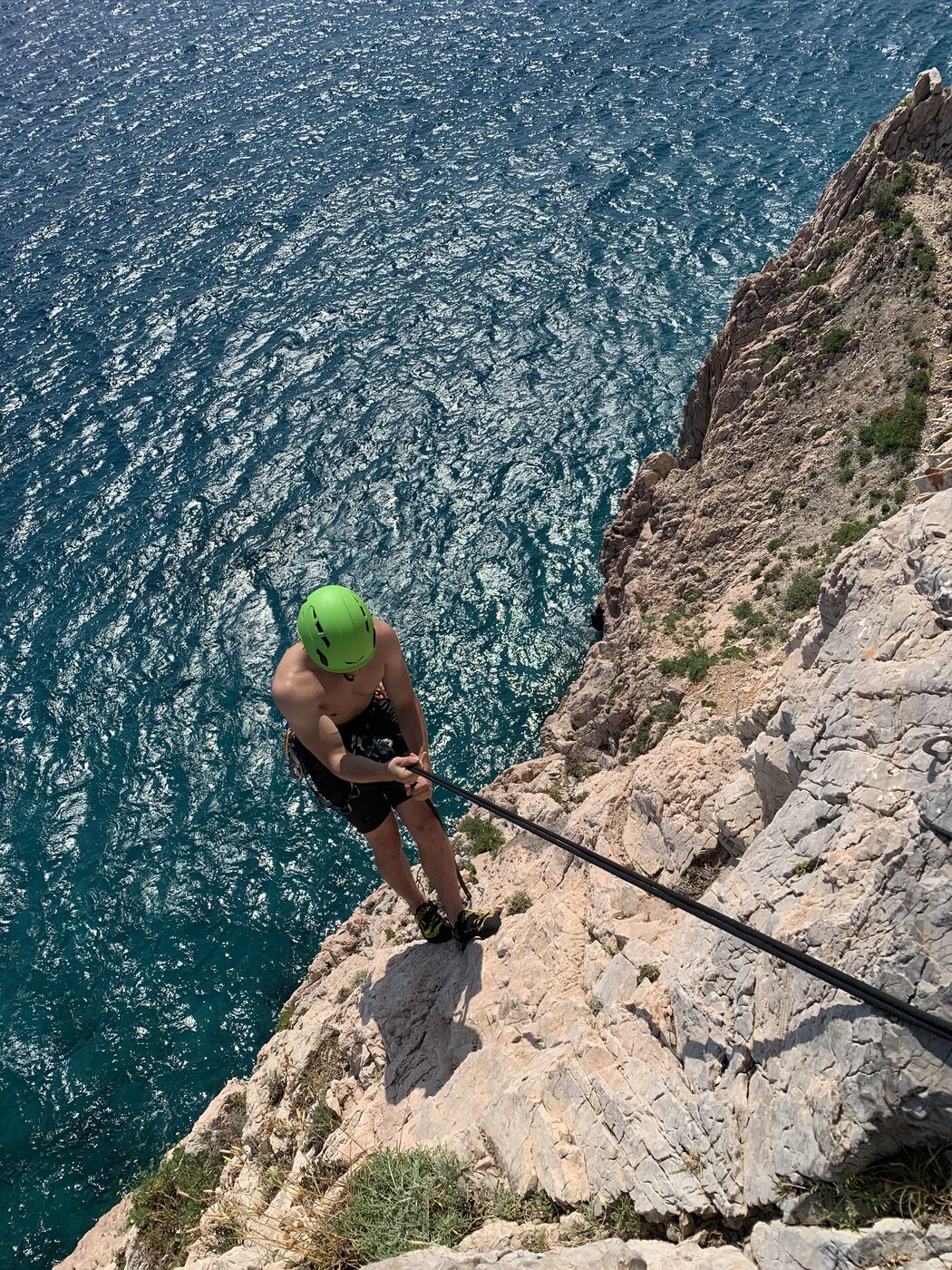 Simone climbing a multi-pitch route